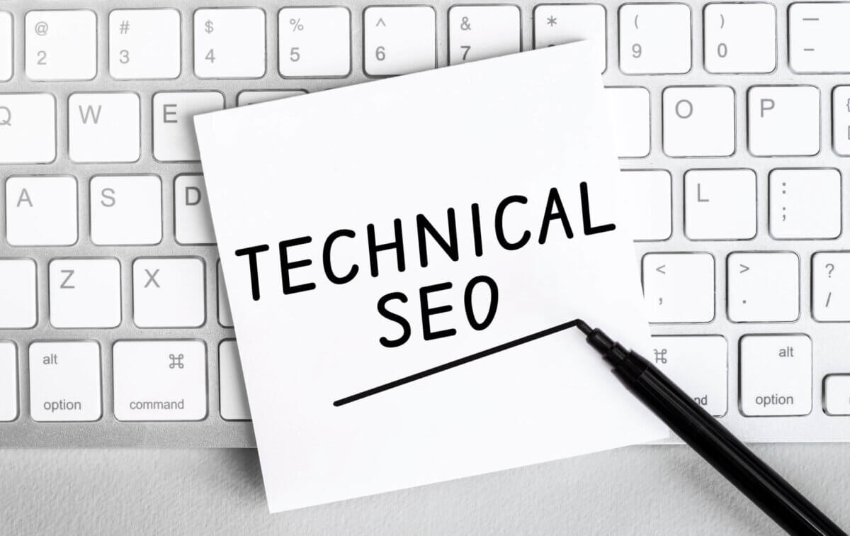 A post-it note with the words "Technical SEO" written on it, underlined with a black ink pen to show its importance